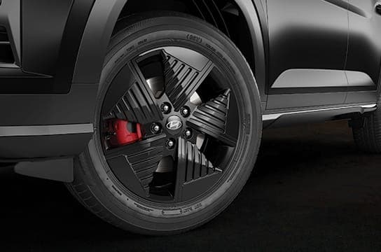 R17 Black alloy wheels with red brake callipers